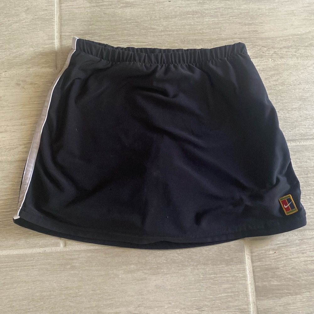 Nike Womens Skorts size S. White stripe on outer skirt and inner shorts